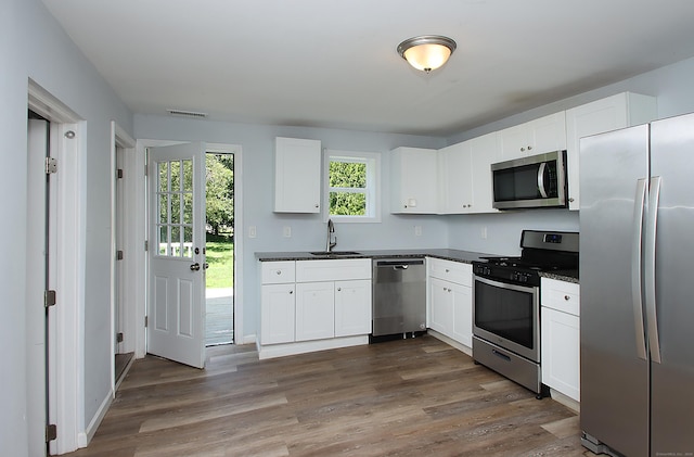 5 Golden Hill Ave, Danbury, CT 06811 - kitchen featuring stainless steel appliances, dark countertops, and dark wood-style floors