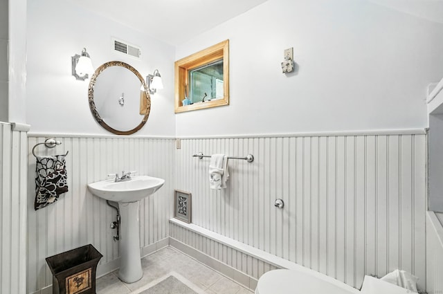 29 Carol St, Danbury, CT 06810 - bathroom featuring a wainscoted wall and tile patterned floors