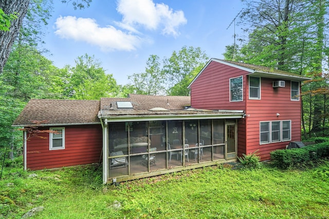 29 Carol St, Danbury, CT 06810 - rear view of house with a wall unit AC, a sunroom, roof with shingles, and a yard