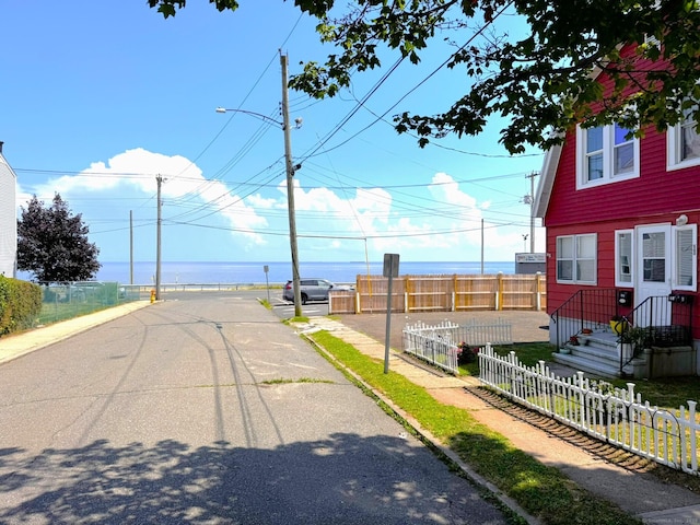 12 Arlington St, West Haven, CT 06516 - view of asphalt street featuring sidewalks, street lights, and curbs
