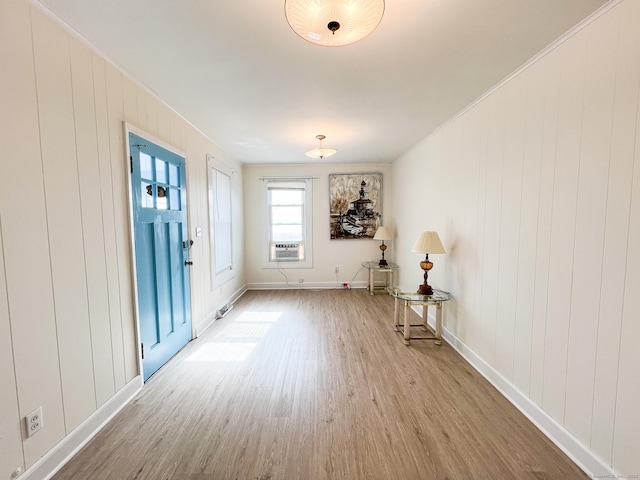 12 Arlington St, West Haven, CT 06516 - empty room featuring wood finished floors, cooling unit, and ornamental molding