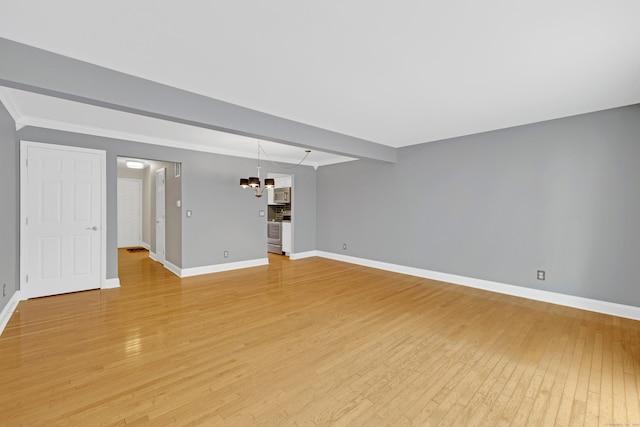 97 Park Ave Unit 70, Danbury, CT 06810 - unfurnished living room with a chandelier, light wood-style flooring, and ornamental molding