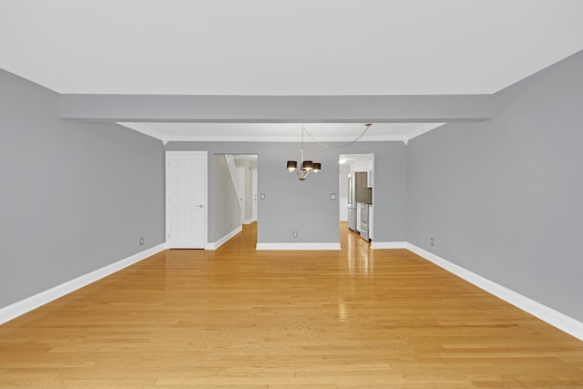97 Park Ave Unit 70, Danbury, CT 06810 - spare room featuring a chandelier, light wood-style floors, and ornamental molding