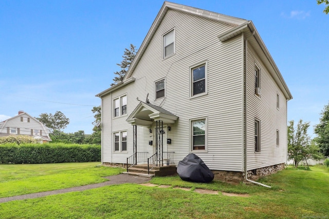 8 Garden St, Naugatuck, CT 06770 - rear view of house with a lawn