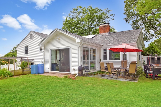 130 Olde Stage Rd, Glastonbury, CT 06033 - back of house featuring roof with shingles, a chimney, and a patio area