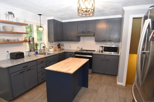 130 Olde Stage Rd, Glastonbury, CT 06033 - kitchen featuring appliances with stainless steel finishes, wood counters, decorative backsplash, pendant lighting, and wood finished floors
