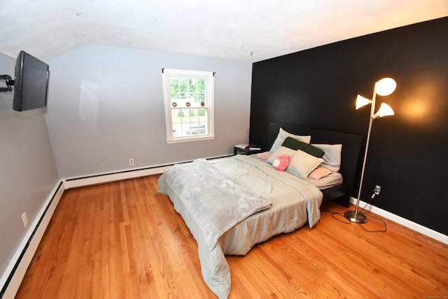 130 Olde Stage Rd, Glastonbury, CT 06033 - bedroom with baseboard heating, wood finished floors, and lofted ceiling