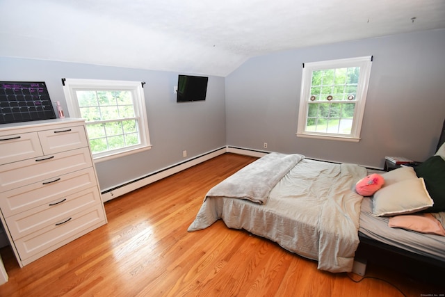 130 Olde Stage Rd, Glastonbury, CT 06033 - bedroom featuring lofted ceiling, a baseboard radiator, light wood-style floors, and multiple windows