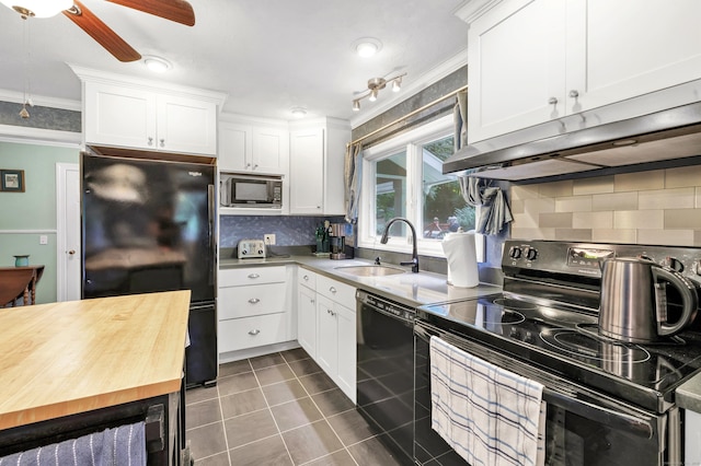 680 Wheelers Farms Rd, Milford, CT 06461 - kitchen featuring black appliances, ornamental molding, butcher block counters, under cabinet range hood, and backsplash