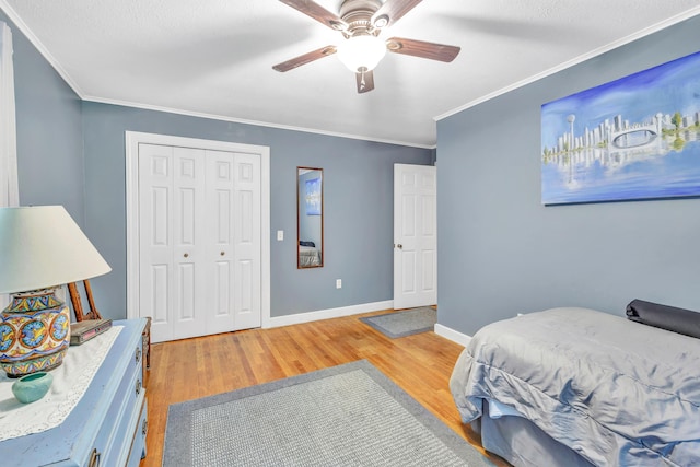680 Wheelers Farms Rd, Milford, CT 06461 - bedroom with light wood finished floors, ornamental molding, a closet, and ceiling fan