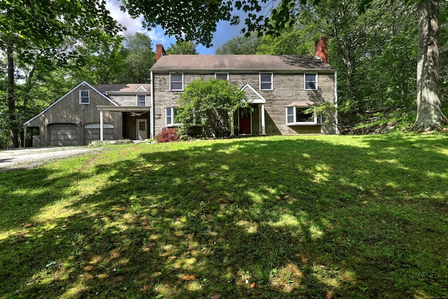22 E Woods Rd, Roxbury, CT 06783 - colonial house featuring a chimney, a front lawn, driveway, and a garage