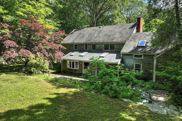 22 E Woods Rd, Roxbury, CT 06783 - back of property featuring a lawn and a chimney