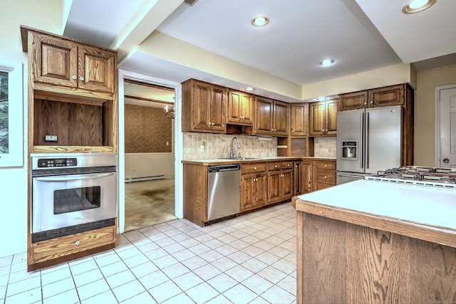 22 E Woods Rd, Roxbury, CT 06783 - kitchen featuring stainless steel appliances, baseboard heating, decorative backsplash, light countertops, and recessed lighting