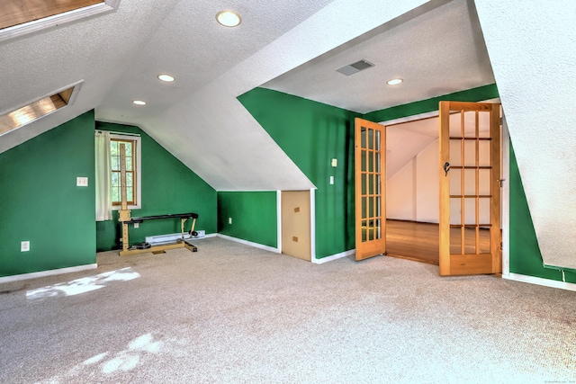 22 E Woods Rd, Roxbury, CT 06783 - additional living space featuring a textured ceiling, carpet flooring, lofted ceiling, and recessed lighting