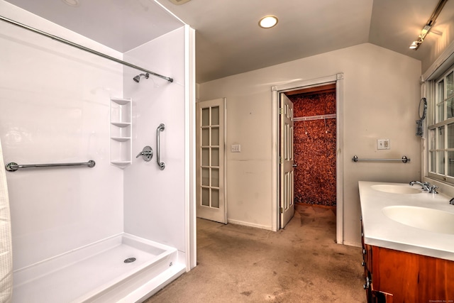 22 E Woods Rd, Roxbury, CT 06783 - full bathroom with walk in shower, double vanity, lofted ceiling, and recessed lighting