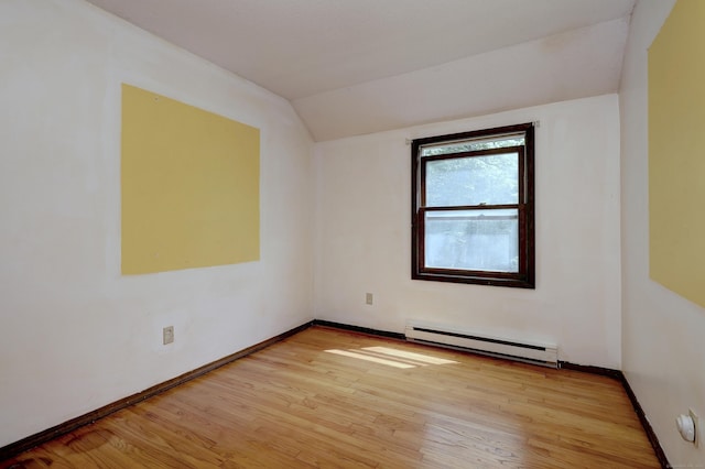 22 E Woods Rd, Roxbury, CT 06783 - empty room featuring baseboard heating, lofted ceiling, and light wood-type flooring
