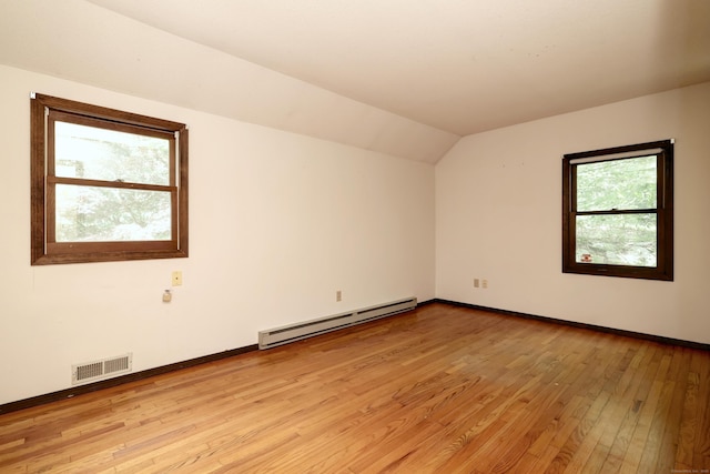 22 E Woods Rd, Roxbury, CT 06783 - spare room featuring baseboard heating, light wood-style flooring, and lofted ceiling