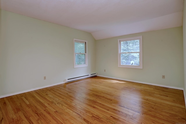 22 E Woods Rd, Roxbury, CT 06783 - empty room with baseboard heating, lofted ceiling, and light wood-style floors