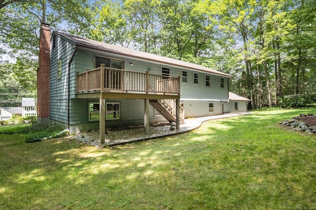 128 Carriage Dr, Avon, CT 06001 - back of property with a chimney, stairs, a deck, and a yard