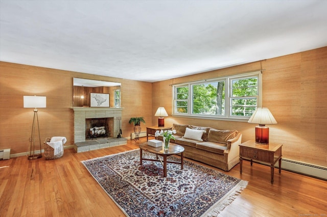 128 Carriage Dr, Avon, CT 06001 - living area featuring wood finished floors, a fireplace, and a baseboard heating unit