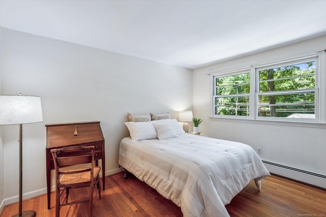 128 Carriage Dr, Avon, CT 06001 - bedroom with a baseboard radiator and wood finished floors