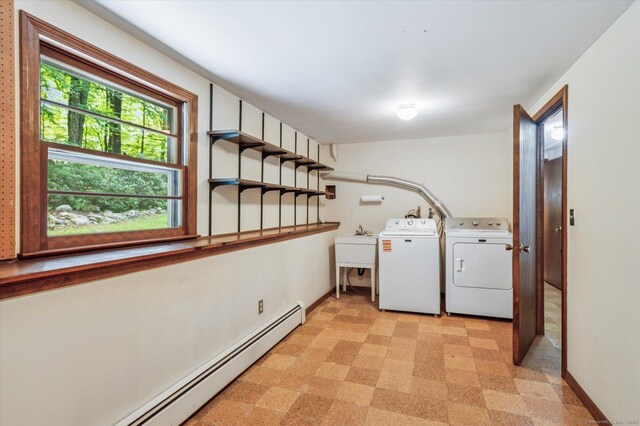 128 Carriage Dr, Avon, CT 06001 - washroom featuring washer and dryer, a baseboard radiator, and light flooring