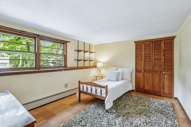 128 Carriage Dr, Avon, CT 06001 - bedroom featuring baseboard heating and a closet