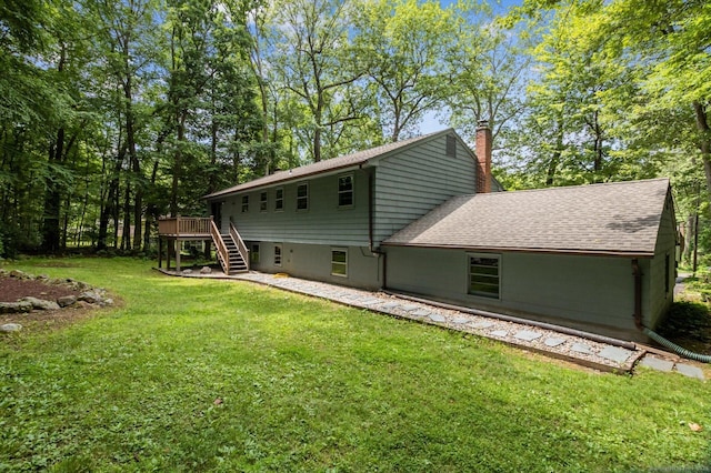 128 Carriage Dr, Avon, CT 06001 - back of house with stairway, a chimney, a lawn, a deck, and roof with shingles