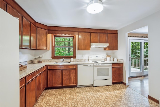 128 Carriage Dr, Avon, CT 06001 - kitchen with white appliances, under cabinet range hood, plenty of natural light, and light countertops