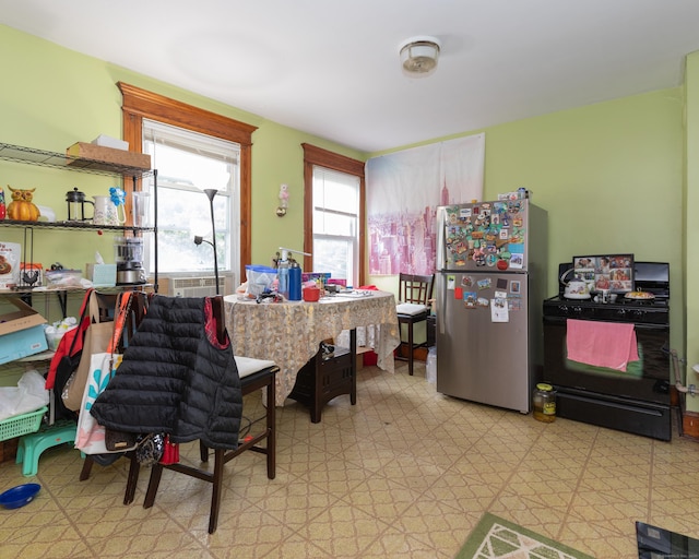 213 Easton Ave, Waterbury, CT 06704 - kitchen featuring freestanding refrigerator, black range with gas cooktop, and light floors