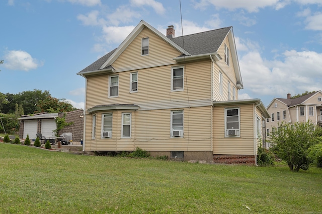 213 Easton Ave, Waterbury, CT 06704 - back of property with a yard, cooling unit, a chimney, and roof with shingles
