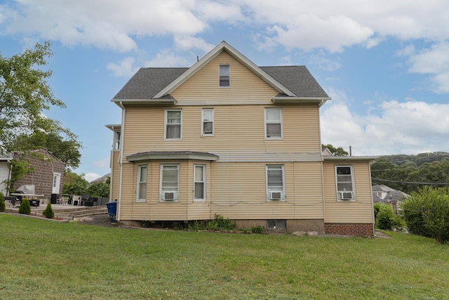 213 Easton Ave, Waterbury, CT 06704 - rear view of house with a yard and cooling unit