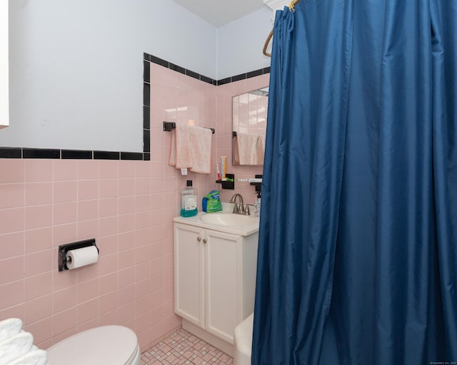 213 Easton Ave, Waterbury, CT 06704 - full bathroom with tile walls, tile patterned floors, vanity, and a shower with curtain