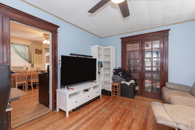 213 Easton Ave, Waterbury, CT 06704 - living area with a ceiling fan, light wood-type flooring, and crown molding