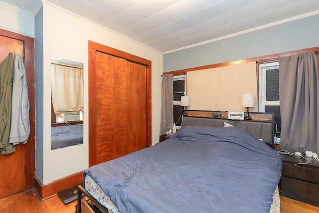 213 Easton Ave, Waterbury, CT 06704 - bedroom featuring ornamental molding, a closet, and wood finished floors