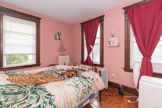 213 Easton Ave, Waterbury, CT 06704 - bedroom with radiator heating unit and wood finished floors