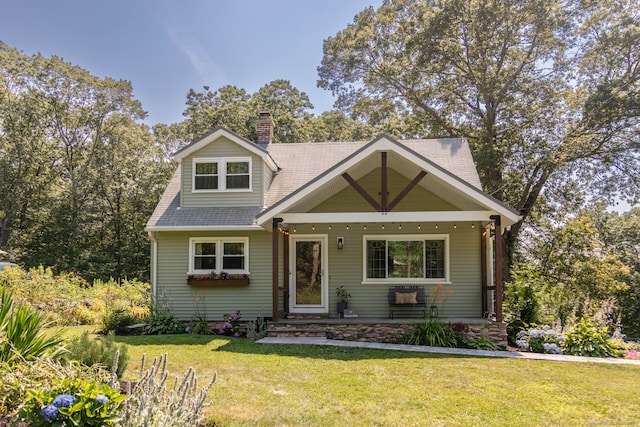 47 Chestnut Hill Rd, East Hampton, CT 06424 - view of front of home featuring a front lawn and a chimney