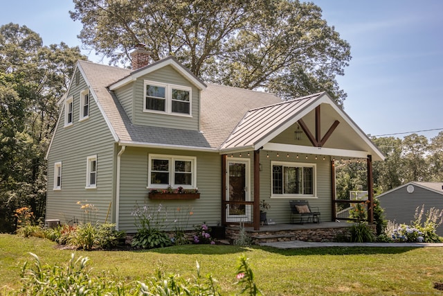 47 Chestnut Hill Rd, East Hampton, CT 06424 - view of front facade featuring a porch, a front yard, and a chimney