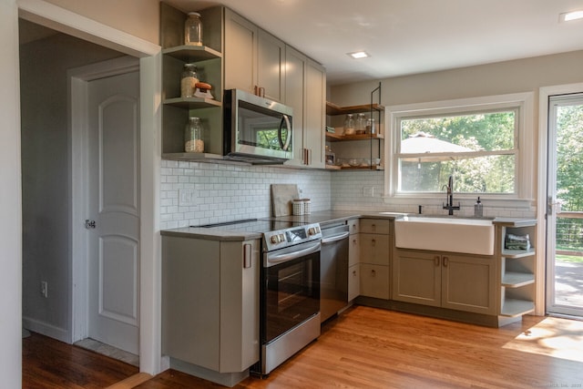 47 Chestnut Hill Rd, East Hampton, CT 06424 - kitchen featuring open shelves, appliances with stainless steel finishes, tasteful backsplash, and healthy amount of natural light