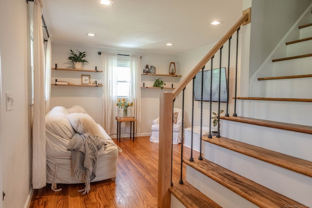 47 Chestnut Hill Rd, East Hampton, CT 06424 - stairway with ornamental molding, wood finished floors, and recessed lighting