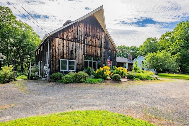 412 Goshen Rd, Litchfield, CT 06759 - view of front of home with a barn, board and batten siding, and an outbuilding