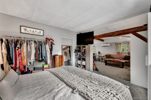 412 Goshen Rd, Litchfield, CT 06759 - carpeted bedroom featuring a wall mounted AC and beam ceiling