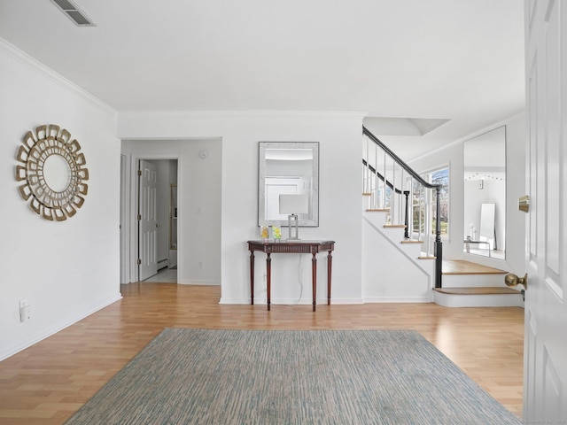 465 Edward St, Fairfield, CT 06824 - foyer featuring wood finished floors, stairs, and ornamental molding