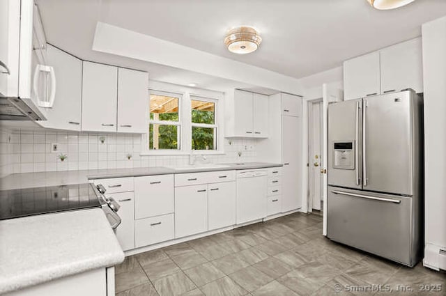 465 Edward St, Fairfield, CT 06824 - kitchen featuring white appliances, light countertops, white cabinetry, and decorative backsplash