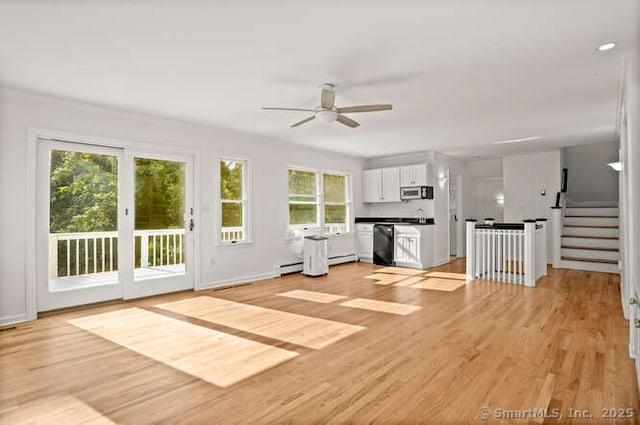 465 Edward St, Fairfield, CT 06824 - unfurnished living room with a ceiling fan, light wood-style flooring, and stairway