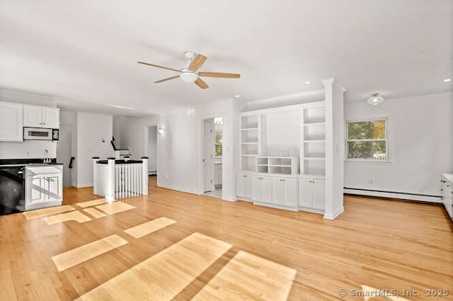 465 Edward St, Fairfield, CT 06824 - unfurnished living room with a ceiling fan, light wood-style flooring, a baseboard heating unit, stairs, and recessed lighting
