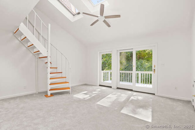465 Edward St, Fairfield, CT 06824 - unfurnished living room featuring carpet flooring, stairway, a skylight, a ceiling fan, and high vaulted ceiling