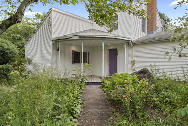 905 Meriden Ave, Southington, CT 06489 - view of front of house with a chimney and roof with shingles