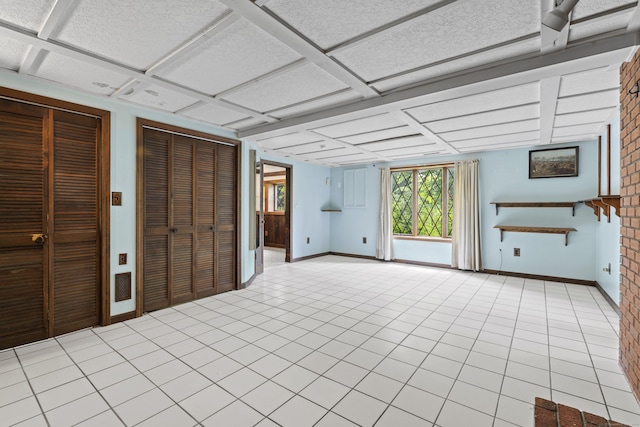 905 Meriden Ave, Southington, CT 06489 - unfurnished living room with coffered ceiling and light tile patterned floors