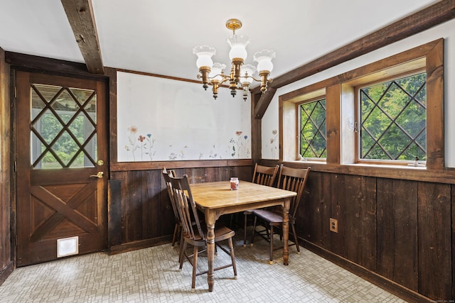 905 Meriden Ave, Southington, CT 06489 - dining room with a chandelier, a wainscoted wall, and wooden walls